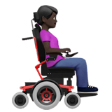 WOMAN IN MOTORIZED WHEELCHAIR FACING RIGHT (dark)